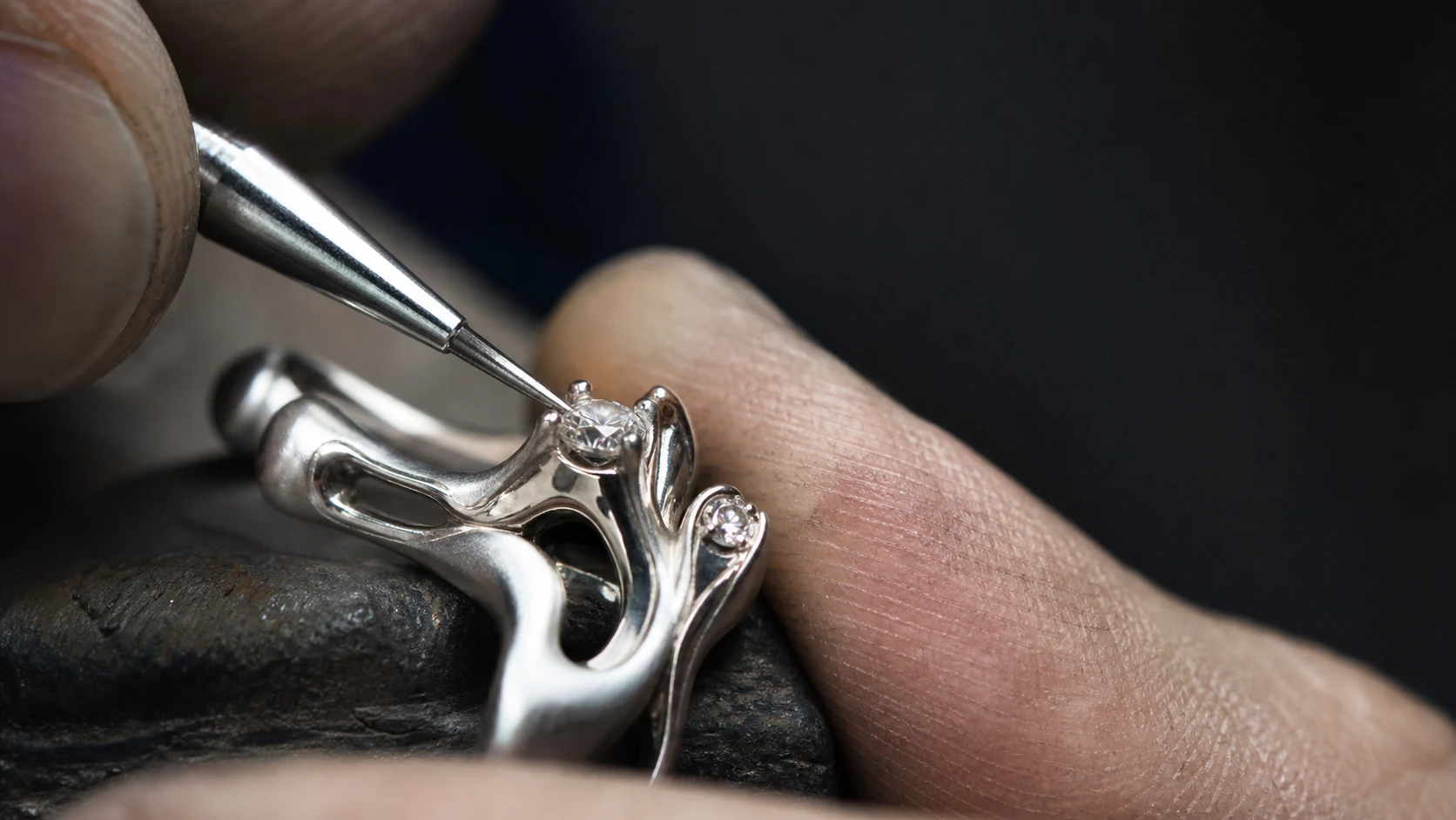 A PARVIC artisan setting a diamond by hand